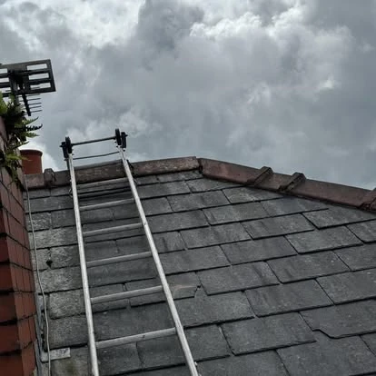 Complete roof replacement project showing new battens and felt installation